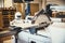 A robot works fully automatically in a carpentry workshop