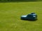 Robotic lawn mower on grass