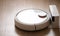 Robotic wireless smart vacuum cleaner stands base of charging