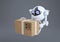 Robots, spherical drones flying with box in their claws