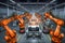 Robots in workshop of automobile plant. Automotive robotic factory. Welding Robot, assembly line production cars Manufacture.