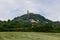 Rocca of Radicofani fortress on the top of a green Tuscan hill from. Italy