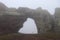 Rock arch in mongolia during fog