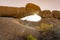 Rock arch at sunset in the Spitzkoppe National Park in Namibia.