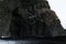 Rock of basalt pillars on a black beach in iceland