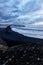 Rock on black sand beach