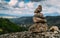 Rock cairn trail marker overlooking a valley in Northeastern Portugal, Europe