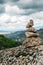 Rock cairn trail marker overlooking a valley in Northeastern Portugal, Europe