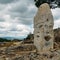 Rock cairn trail marker overlooking a valley in Northeastern Portugal, Europe.