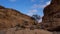 Rock cairns packed on a rock in the riverbed of the Sesriem Canyon, a popular hiking trail at Sesriem, Namibia