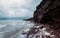 A rock cliff above the water with a tidal shoreline. Tersky coast of the White Sea.. Panoramic view