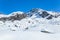 Rock cliff and snowy peak in Hatcher Pass area of the Talkeetna Mountains