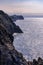 Rock cliffs jutting into the blue sea in the Cantabrian Sea. Santander