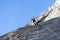 Rock climber abseiling off a climb
