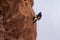 Rock climber belaying down hoodoo