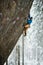 Rock climber on a challenging ascent. Extreme climbing. Unique winter sports. Scandinavian nature.