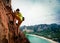 rock climber climbing on seaside cliff