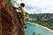 Rock climber climbing at seaside cliff