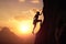 Rock climber in the evening a young woman of an overhanging cliff