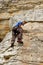 Rock climber looks down