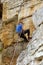 Rock climber looks down