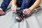 Rock climber puts on rocky shoes in a bouldering hall at a climbing gym