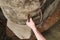 Rock climber\'s hands on steel handhold anchored in sandstone rock. Tourist path via ferrata.