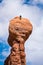 Rock climber on top of a hoodoo, Utah