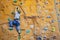 Rock-climbing boy with help