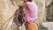 Rock climbing details. woman taking on climbing rope and preparing to climb. 120fps slow motion.