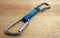 Rock climbing quickdraw with two aluminium carabiners and a blue sling