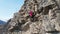 Rock climbing training on steep slope in mountains