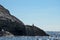 Rock closeup on the coast sea and the bird on the background of blue sky, Crimea