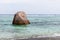 Rock is on the coast of La Digue island, Seychelles. Anse Union beach