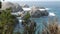 Rock crag of cliff, ocean beach, Point Lobos, California coast. Waves crashing.