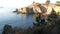 Rock crag of cliff, ocean beach, Point Lobos, California coast. Waves crashing.