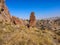 Rock and dry grass on a mountainside against the background of the cityscape of Ankara Turkey on an autumn sunny day. Ruins of