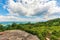 Rock on the edge of a forested hill