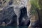 Rock formation with cave at Halldorsskora or Elephant Rock on the Coast of Heimaey Island- Vestmannaeyjar-Westman Islands-Iceland