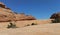 Rock formations, bald and scrub landscape at Arches NP Delicate Arch trail