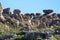 Rock formations on hill with blue sky