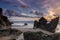 Rock formations at La Barrosa beach in Cadiz at sunset