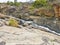 Rock Formations and Waterfall