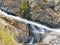 Rock Formations and Waterfall