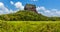 The rock fortress of Sigiriya protrudes above the jungle canopy in Sri Lanka