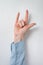 Rock on hand gesture. female hand showing two fingers. Vertical frame