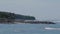 Rock jetty in the middle of a seashore in Bali, Indonesia