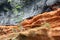 Rock layers of lava and red tuff at the south coast of Madeira