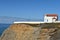 Rock object at Atlantic Ocean Portugal with Church