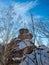 A rock with an Orthodox cross on mountain Church in the winter in Belokurikha, Russia